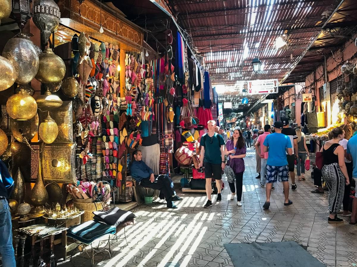 Busy souk streets of Marrakech filled with traditional crafts, an essential experience recommended by all Marrakech travel tips.
