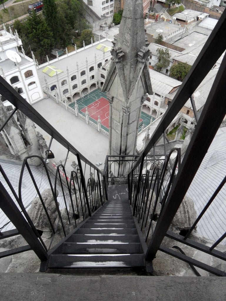 A view looking down from the narrow stairs you must climb to see the view from the Basilica in Quito, a popular attraction. 