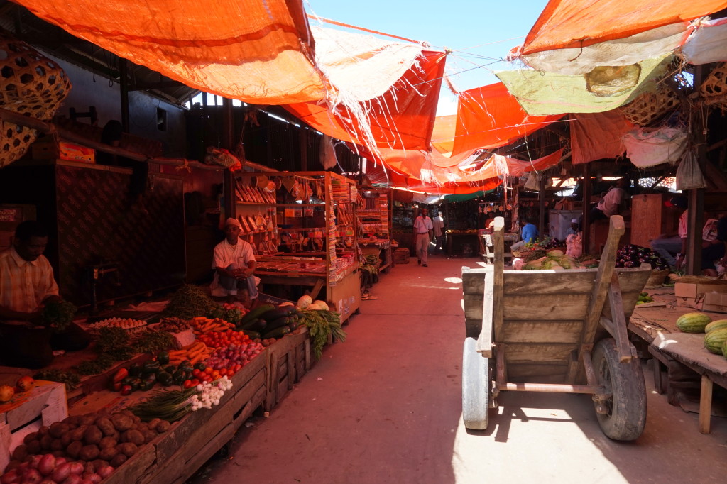 Colorful market in Stone Town, Zanzibar featuring fresh produce.