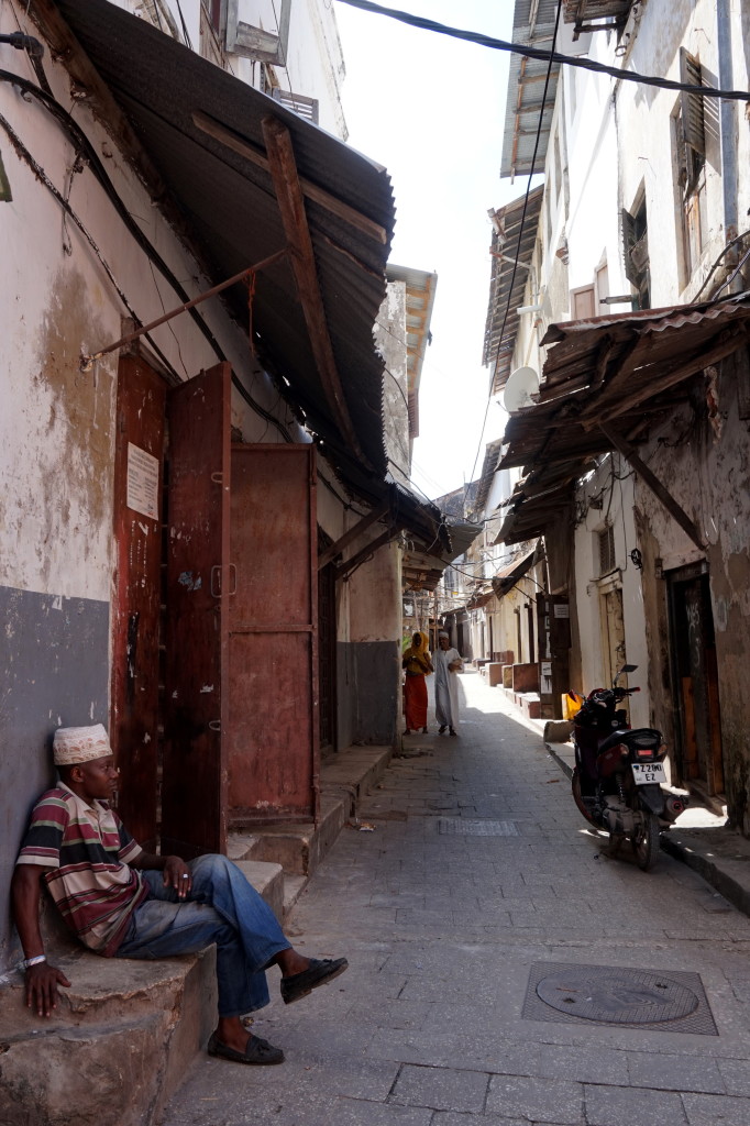 A narrow winding street where you can easily get lost if you don't have a guide for visiting Stone Town in Zanzibar