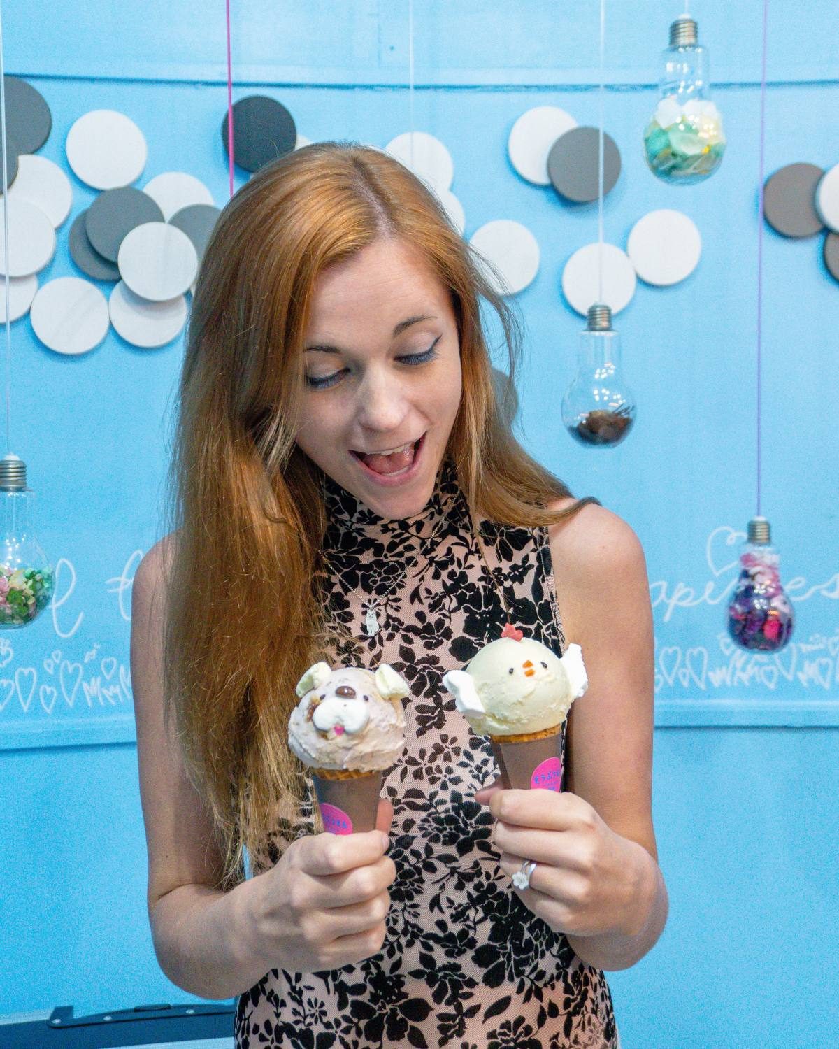 Woman delighted by adorable animal ice cream cones, a sweet treat in Tokyo.
