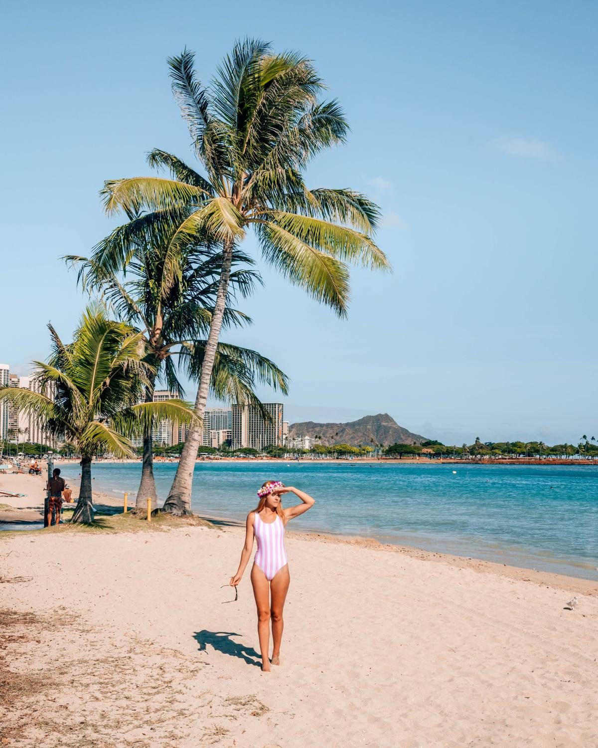 Lady wearing cute pink and white striped swimsuit purchased from SheIn.