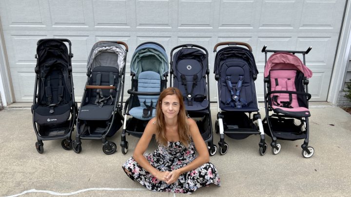 Woman sitting with an array of strollers for airplane travel, highlighting various compact designs that easily fit in overhead bins.