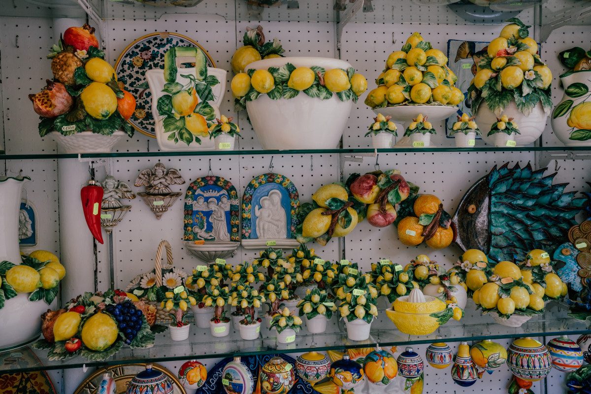 Display of colorful ceramic fruits, a popular choice for those wondering what to buy as souvenirs in Italy.

