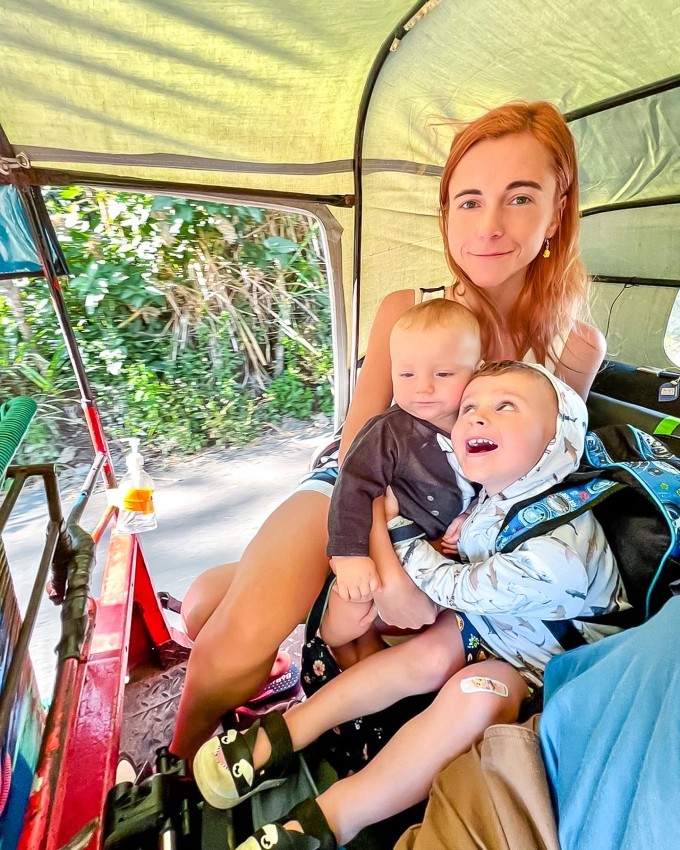 Riding a tuktuk with baby and toddler in El Salvador