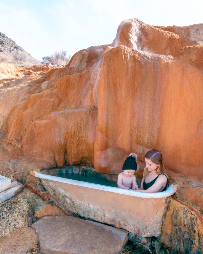 Mom and baby visiting Mystic Hot Springs in Utah