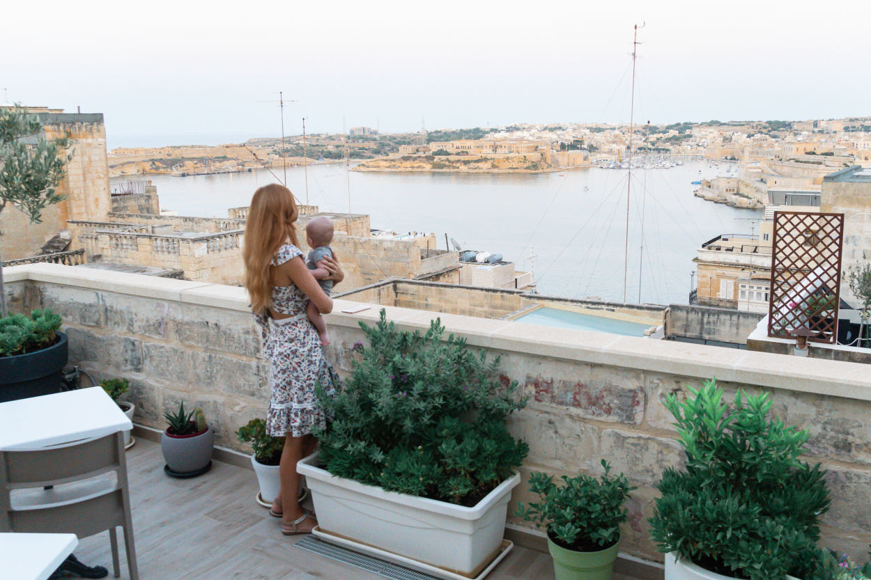 Baby travel in Malta looking over Valetta