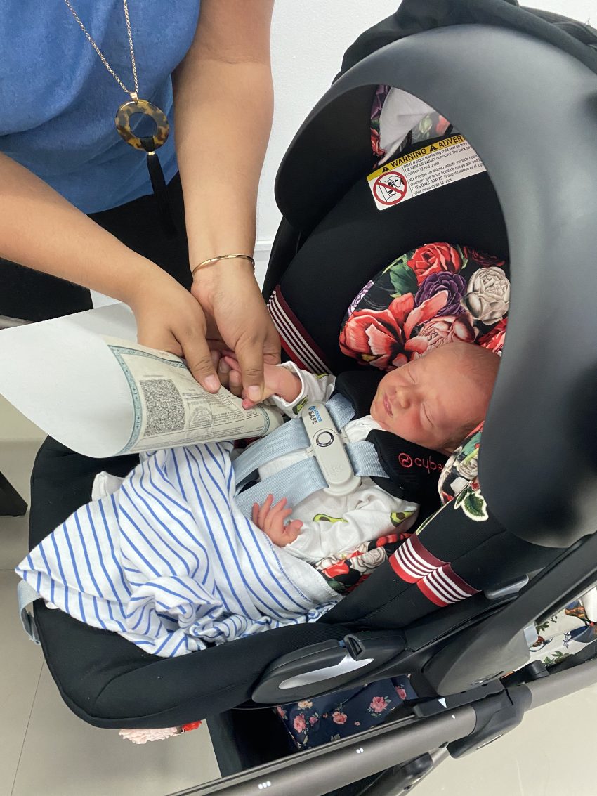 Newborn signing Mexican passport with a fingerprint