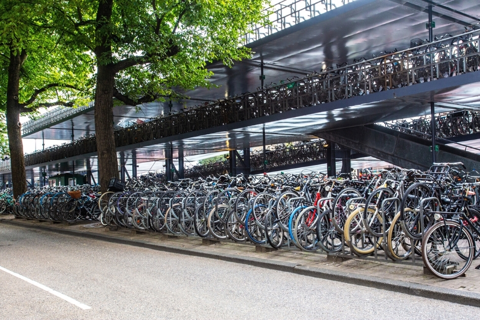 Massive bike parking in Amsterdam, highlighting the city's cycling culture, not to miss on a 2-day Amsterdam tour.