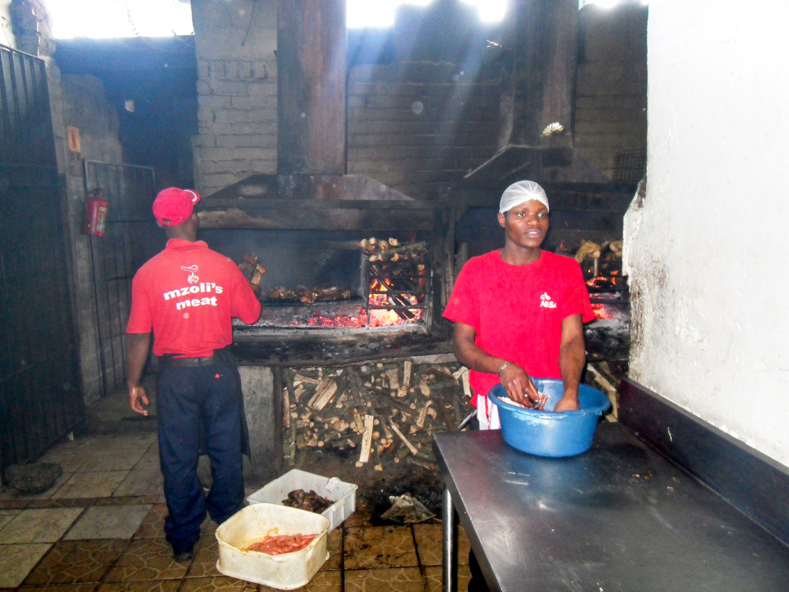 Traditional South African braai at a local eatery in Cape Town, showcasing the country's rich barbecue culture and offering a taste of local flavors to visitors.
