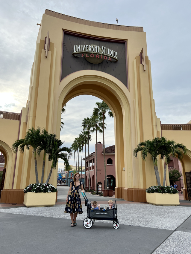 A mother and her toddlers in a stroller, ready for a day of adventure at Universal Studios Orlando, a popular destination for families with young children.
