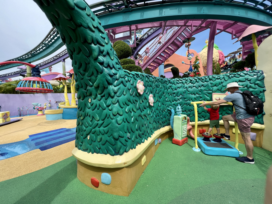 Toddler playing at a water play area, enjoying the interactive, toddler-friendly attractions at Universal Studios Orlando.
