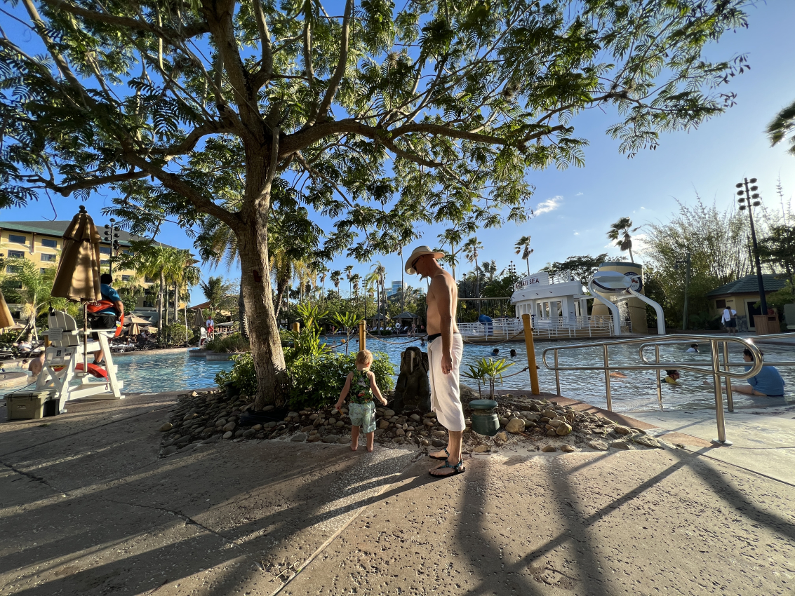 Family poolside at the Lowes Royal Pacific hotel which includes free Universal express passes in it's rates.