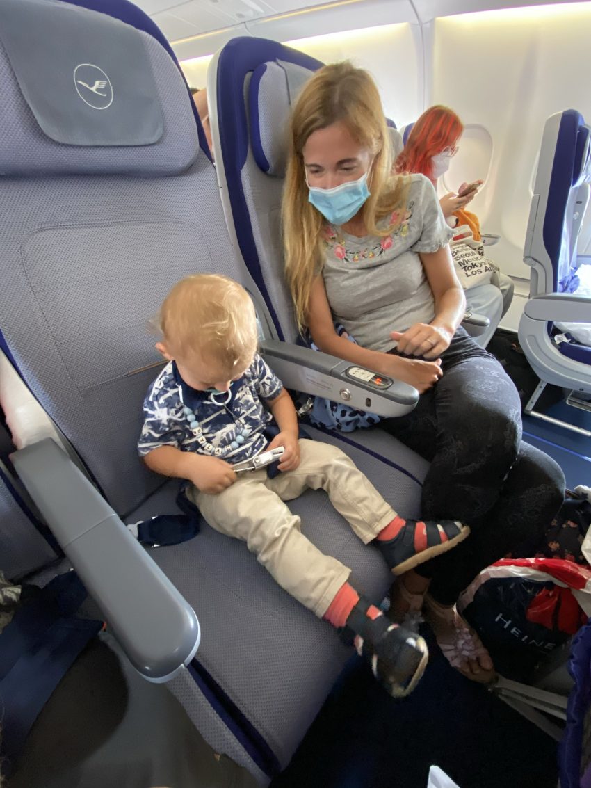 Flying Lufthansa with toddler trying to strap seatbelts